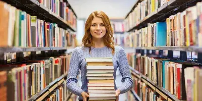 An author signing books at a convention